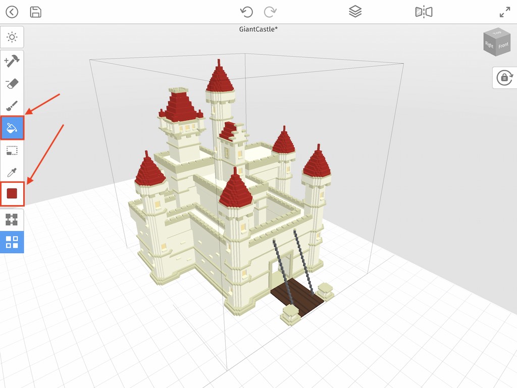 Using the bucket fill tool to change the color of the voxel castle roof